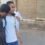 طالب يساند صديقه على عكاز أثناء دخوله لجنة الثانوية العامة بقنا